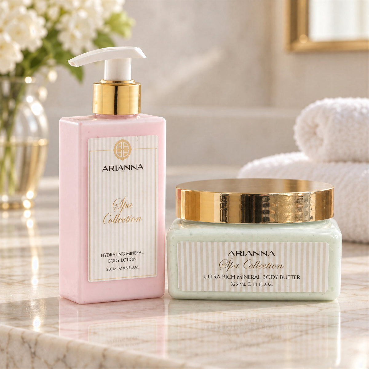 Arianna Hydrating Mineral Body Lotion and Ultra Rich Mineral Body Butter on a marble counter with flowers and towels