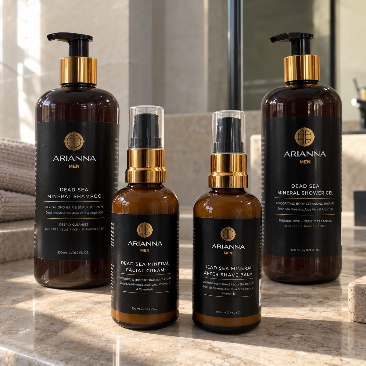 The Men's Grooming Ritual by Arianna Men: Dead Sea Mineral Shampoo, Facial Cream, After Shave Balm and Shower Gel on a marble counter